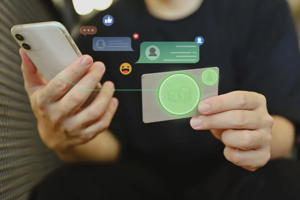 Pessoa usando smartphone e cartão de crédito com ilustrações de mensagens, emoji e ícones de economia, demonstrando como usar a Meta AI no WhatsApp para vender mais e reduzir custos.